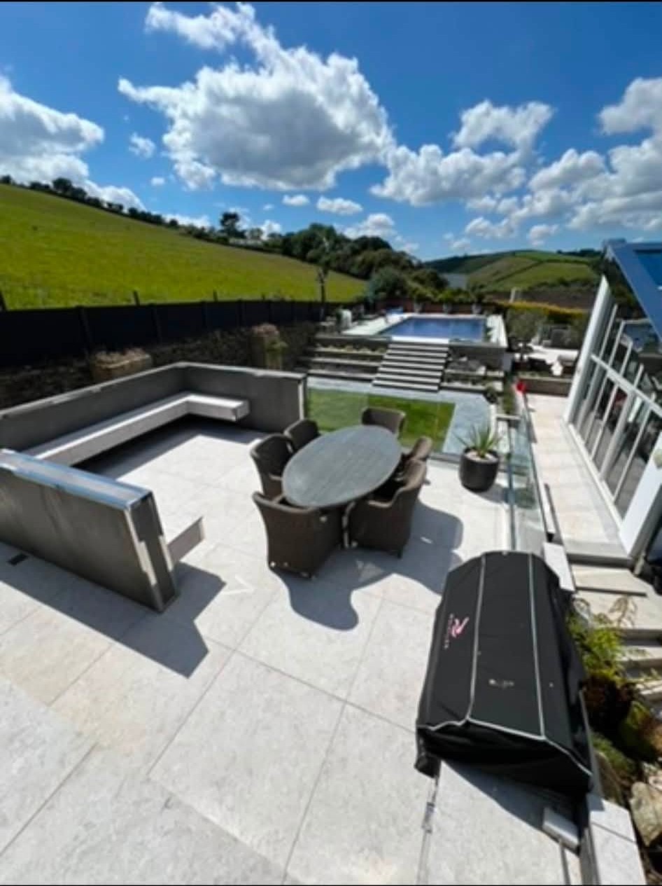 Finished outdoor terrace with seating and landscaped levels
