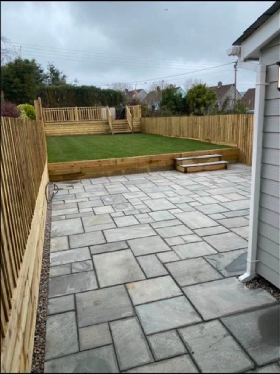 Finished paved garden with raised lawn